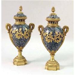 A PAIR OF HARDSTONE ORMOLU- MOUNTED URNS