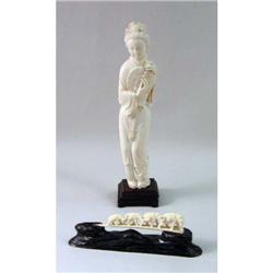 A CARVED BONE FIGURAL GROUP