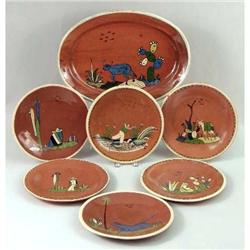 A GROUP OF RED GLAZED PLATES