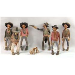 A GROUP OF SIX CARVED POLYCHROME PAINTED COWBOY FIGURES