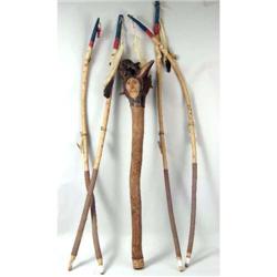 A CARVED AND POLYCHROME- DECORATED NATIVE AMERICAN WOOD CLUB