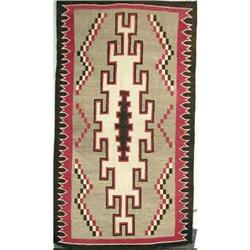 A NATIVE AMERICAN WOVEN RUG