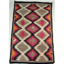 A NATIVE AMERICAN WOVEN RUG