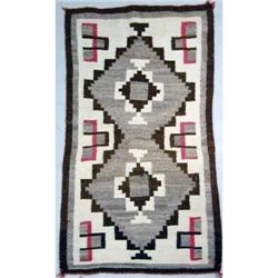 A NATIVE AMERICAN WOVEN RUG