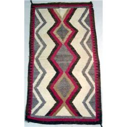 A NATIVE AMERICAN WOVEN RUG
