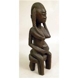 A GROUP OF THREE CARVED WOODEN SCULPTURES