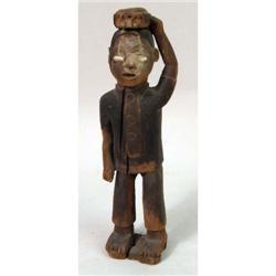 A CARVED WOODEN SCULPTURE