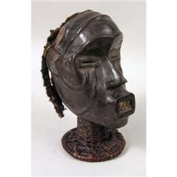 AN AFRICAN RATTAN AND LEATHER COVERED FIGURAL HEADDRESS