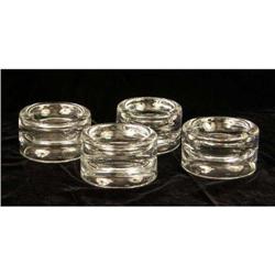A SET OF FOUR COLORLESS KOSTA SHALLOW BOWLS
