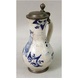 A POLYCHROME-DECORATED AND PEWTER-MOUNTED TIN GLAZED EARTHENWARE PITCHER