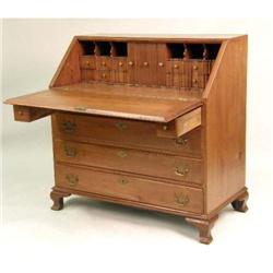 A CHIPPENDALE CARVED AND FIGURED WALNUT SLANT-FRONT DESK
