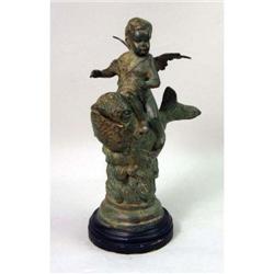 A PATINATED BRONZE SCULPTURE