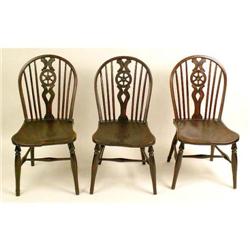 A SET OF SIX ELMWOOD WINDSOR DINING CHAIRS