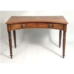 A VICTORIAN WALNUT CONCAVE-FRONT WRITING TABLE