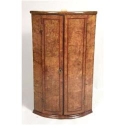 A GEORGE III INLAID BURLWOOD HANGING CORNER CUPBOARD