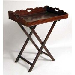 A GEORGE III MAHOGANY BUTLER`S TRAY ON FOLDING STAND