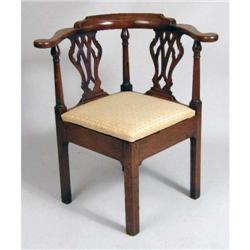 A GEORGE III MAHOGANY CORNER CHAIR