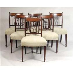 A SET OF SIX GEORGE III CARVED MAHOGANY DINING CHAIRS