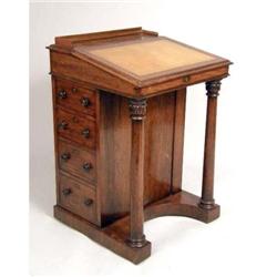 A VICTORIAN WALNUT AND LEATHER-TOPPED DAVENPORT