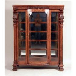 A VICTORIAN CARVED OAK BOOKCASE