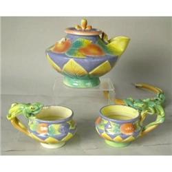 A CERAMIC POLYCHROME-DECORATED LIZARD-MOTIF TEAPOT