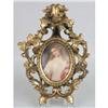 Image 1 : A FRAMED OVAL PORCELAIN PLAQUE DEPICTING A YOUNG LADY WITH ROSE AND SHAWL