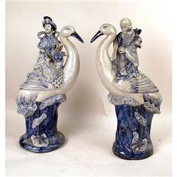 A PAIR OF BLUE AND WHITE PORCELAIN FIGURAL GARNITURES