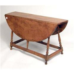 A WILLIAM AND MARY STYLE FIGURED MAPLE BUTTERFLY TABLE