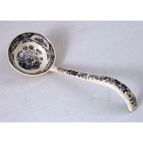 A LARGE TRANSFERWARE SOUP TUREEN AND LADLE