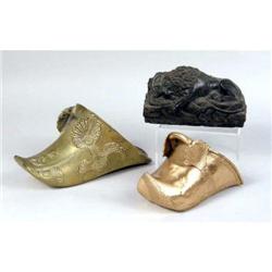 A CARVED RECUMBENT MARBLE LION