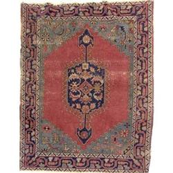 A SMALL PERSIAN RUG