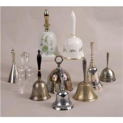 A GROUP OF TEN ASSORTED DINNER AND SERVING BELLS