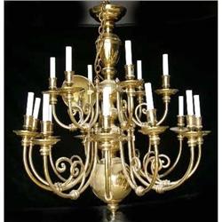 A BAROQUE STYLE BRASS MULTI ARMED TIERED CHANDELIER