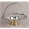 Image 1 : A SILVER ON COPPER HANDLED FOOTED CIRCULAR CAKE BASKET