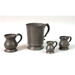 A GROUP OF FOUR PEWTER MEASURES