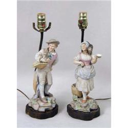 A PAIR OF CONTINENTAL CERAMIC FIGURAL TABLE LAMPS