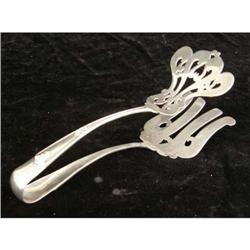 A DOMINICK & HAFF STERLING SILVER PASTRY TONGS