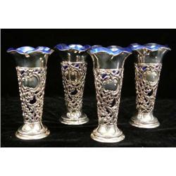 A SET OF FOUR GORHAM STERLING SILVER BUD VASE HOLDERS WITH COBALT GLASS INSERTS