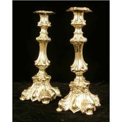 A PAIR OF ROCOCO SILVER PLATED CANDLESTICKS
