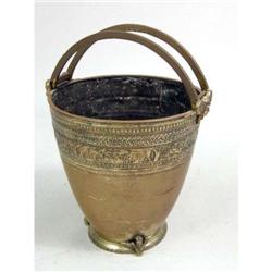 A CAST BRASS DOUBLE-HANDLED BUCKET