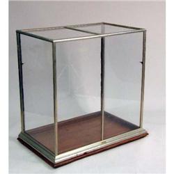 A GLASS AND MOLDED METAL DISPLAY CABINET