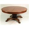 Image 1 : A CLASSICAL CARVED MAHOGANY CIRCULAR EXTENSION DINING TABLE