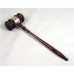 A METAL-MOUNTED STAINED PINE GAVEL