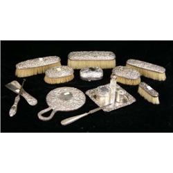 A GROUP OF FIFTEEN STERLING SILVER HANDLED DRESSER ITEMS