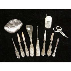 A GROUP OF ELEVEN STERLING SILVER AND SILVER PLATED HANDLED DRESSER ITEMS