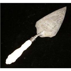AN ENGLISH STERLING SILVER IVORY HANDLED PRESENTATION TROWEL