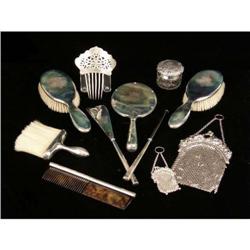 A MISCELLANEOUS GROUP OF ELEVEN STERLING SILVER AND SILVER PLATED ITEMS