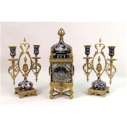 A LATE VICTORIAN PORCELAIN AND BRASS MANTLE GARNITURE