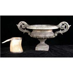 A CAST-IRON URN-FORM JARDINIERE