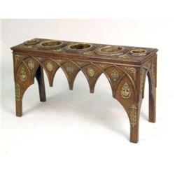 AN UNUSUAL BRASS-MOUNTED STAINED PINE JARDINIERE STAND